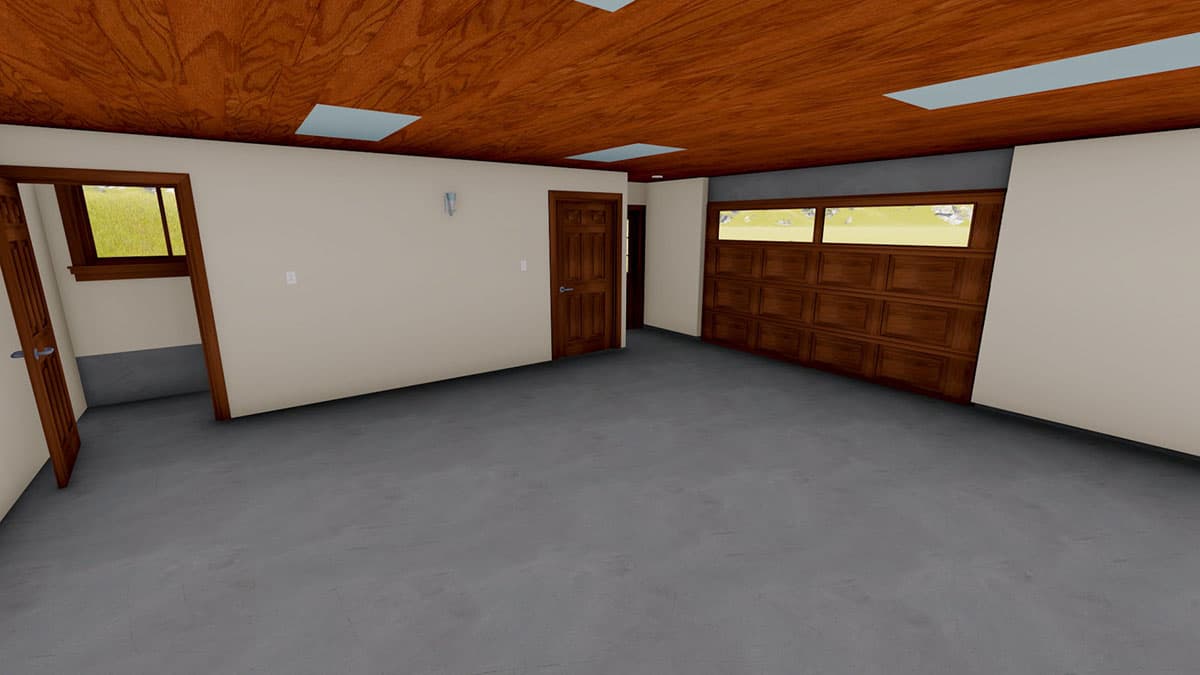 Interior view of garage with wood panel door, windows, wood ceiling, and concrete floor.