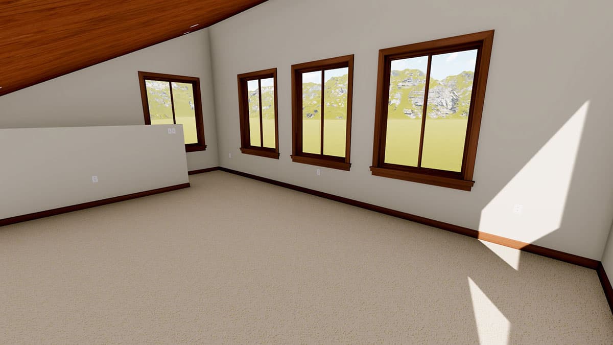 Interior view of a room with a sloped wood ceiling, a short partition wall, and four windows with mountain views.