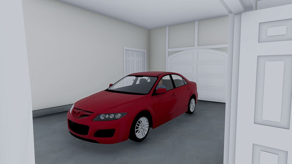 Interior view of a garage with a red sedan and a paneled garage door.