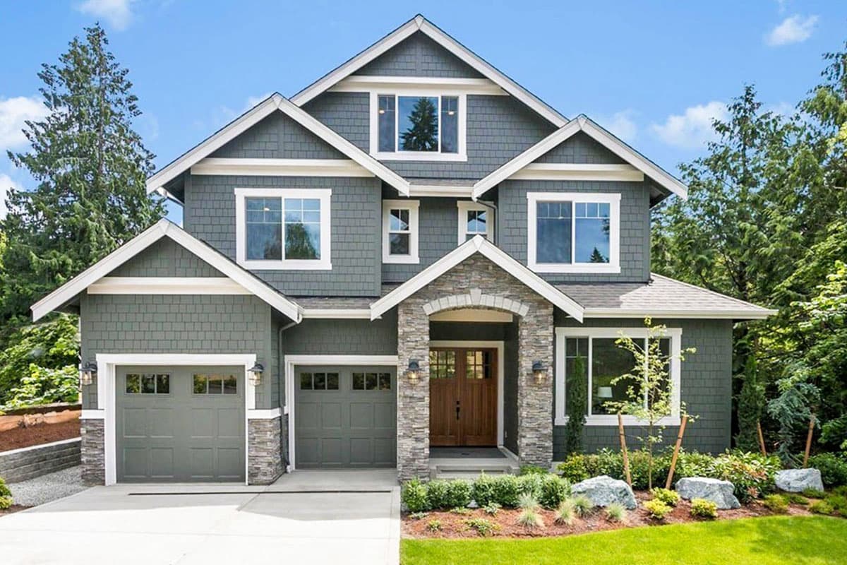 House plan exterior featuring Craftsman style, two stories, gabled roof, stone accents, and attached garage. Includes double door entry.