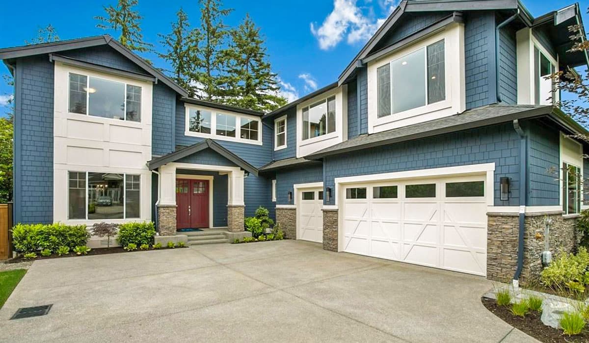 House plan exterior. Two-story home with Craftsman style. Features include multiple gables, a covered entry, and an attached garage.
