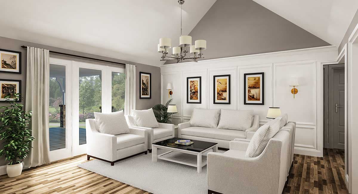 Living room with vaulted ceiling, large windows, paneled walls, and fireplace.