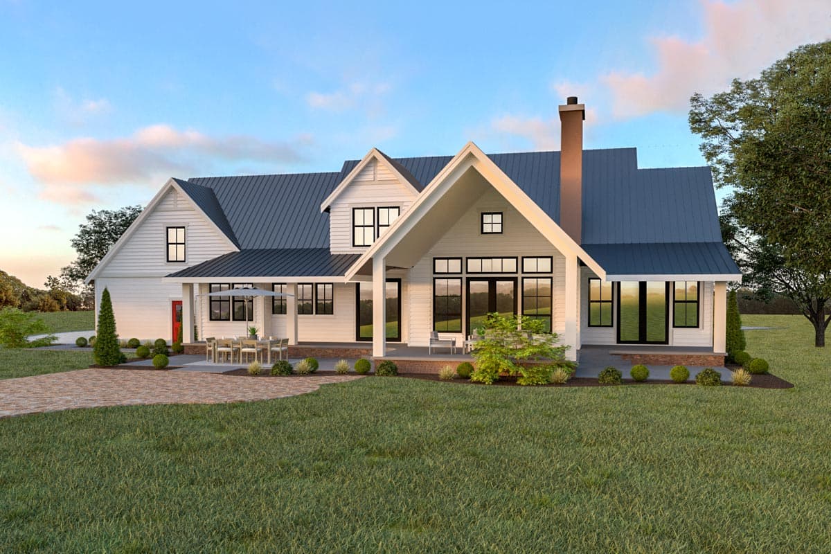 Modern Farmhouse house plan exterior with metal roof, gables, covered porch, and large windows.