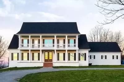 Stately Two-Story Country House Plan with First-Level Master Bed