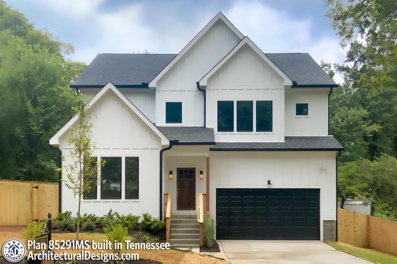 House plan exterior with Modern Farmhouse style, two stories, front-entry porch, gables, and attached garage with a dark garage door.