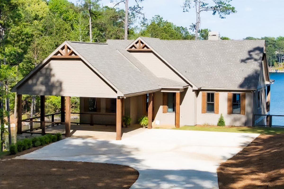House plan exterior: Ranch style, single-story home with a carport, prominent gables, and timber accents.