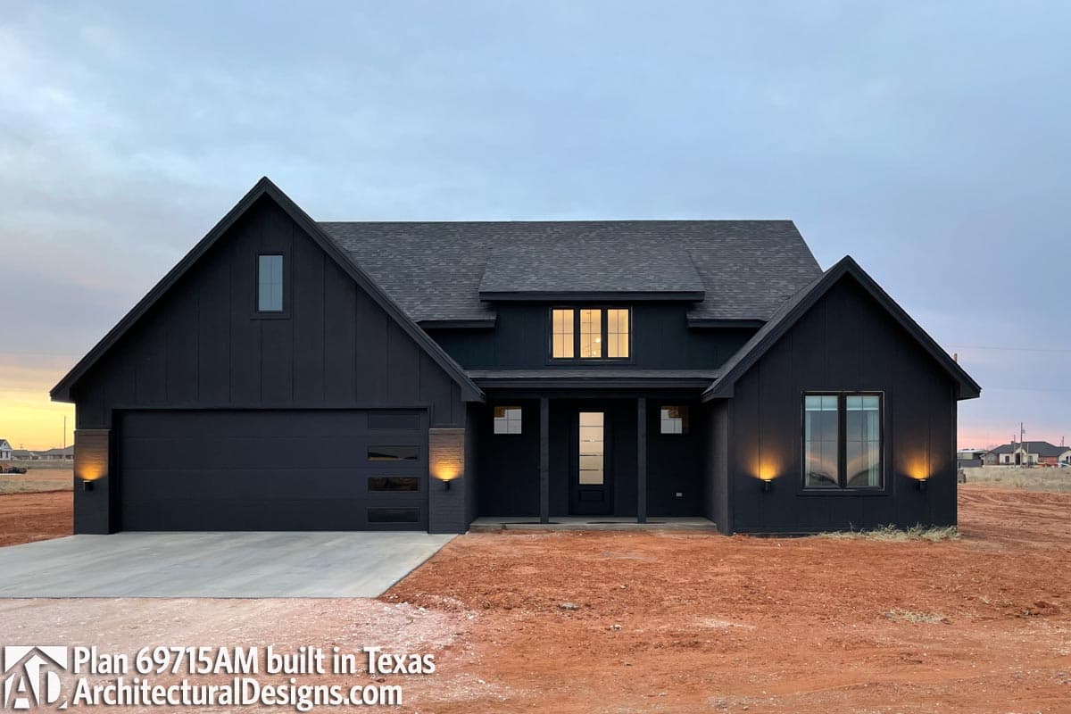 Modern Farmhouse house plan exterior with dark board and batten siding, gabled roofs, covered porch, and attached garage.