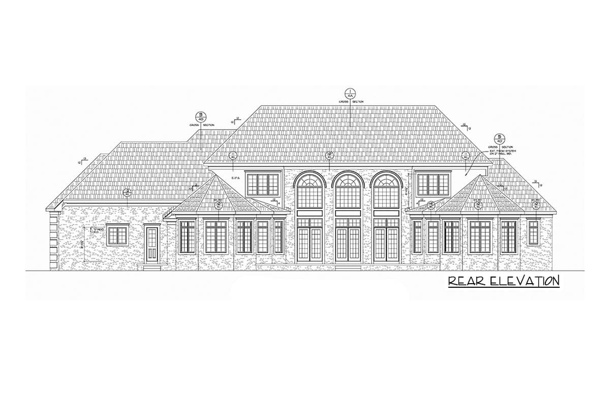 Rear elevation drawing of a house plan featuring a multi-gabled roof, arched windows, and brickwork detail.