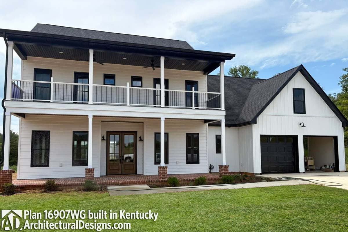 Modern Farmhouse house plan exterior with two stories, wraparound porch, double front doors, and attached garage.
