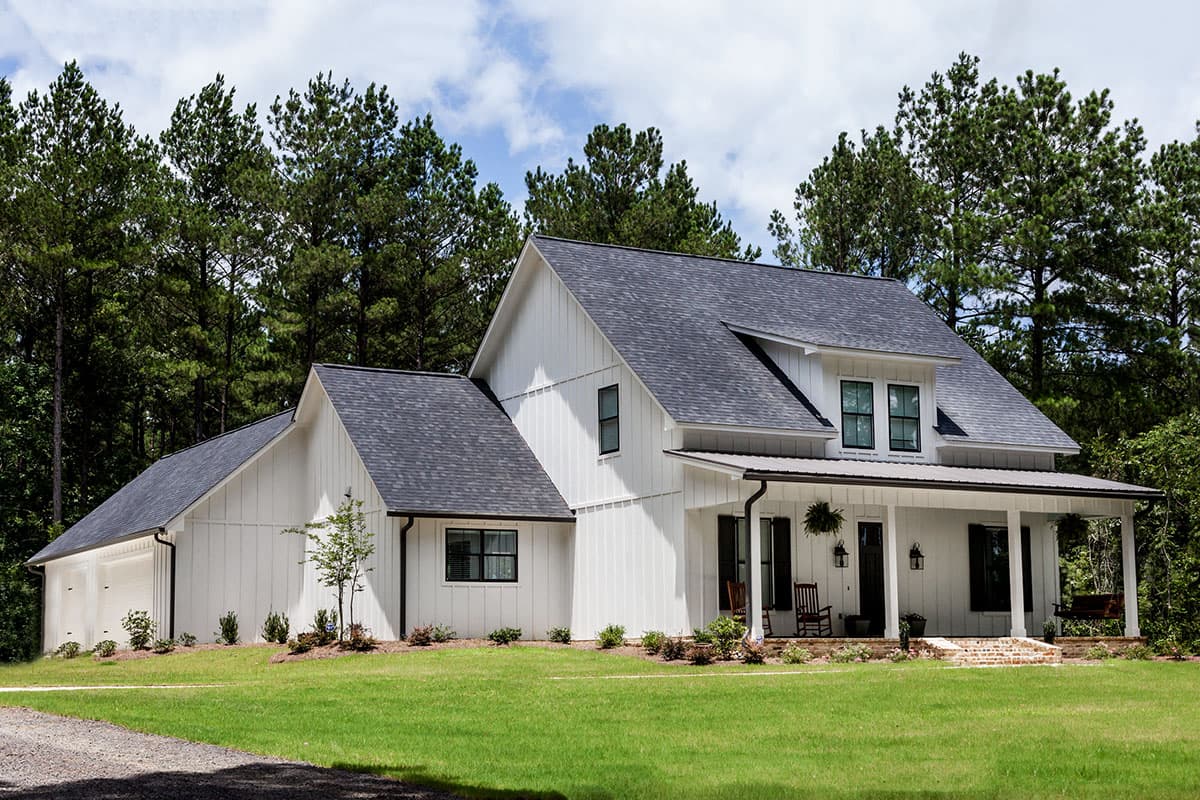 Modern Farmhouse house plan exterior with board-and-batten siding, a gabled roof, and a wrap-around porch.