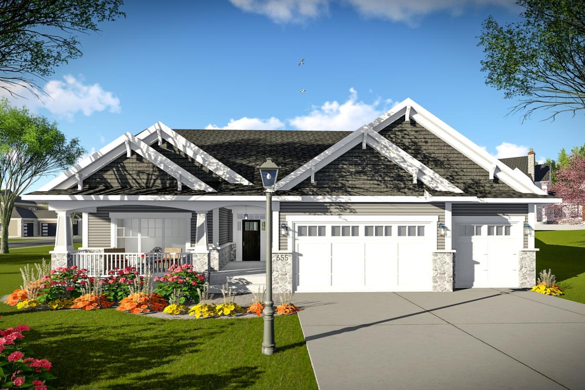 Craftsman style house plan exterior featuring a wraparound porch, multiple gables with decorative rafter tails, and a triple-car garage.