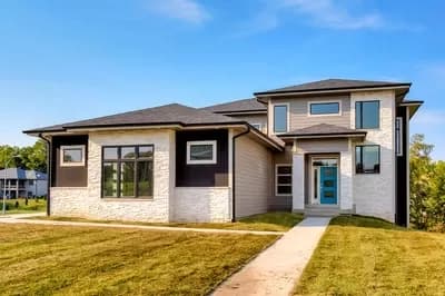 Modern Prairie House Plan with Laundry on Both Floors
