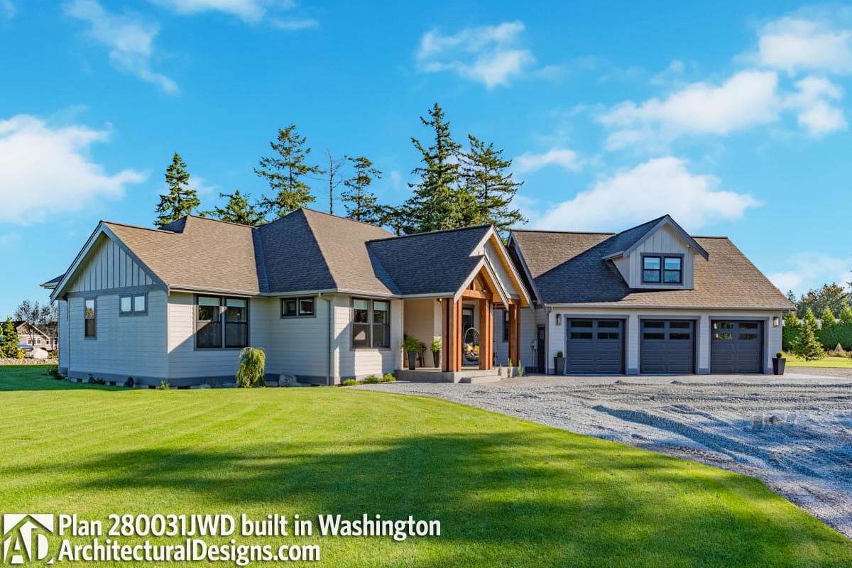 Modern Ranch house plan exterior with a covered entry, gabled dormer, and a three-car garage.