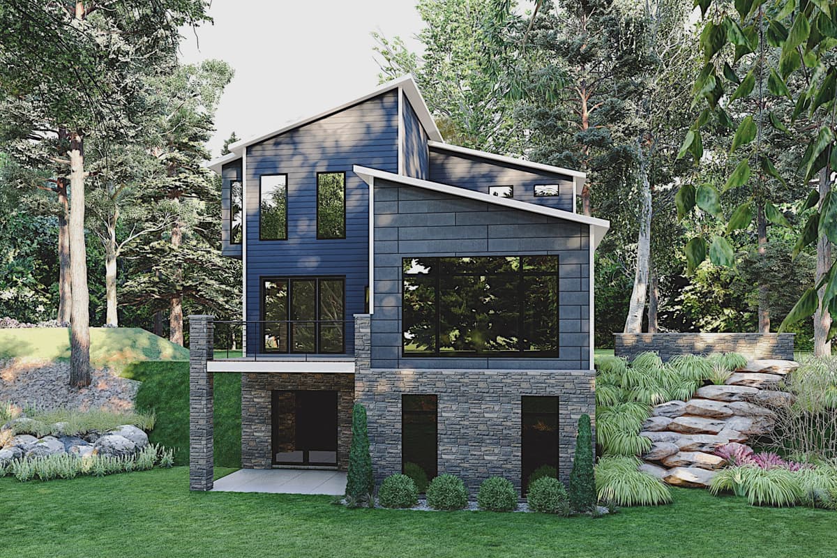 Modern house plan exterior with two stories, shed roof, and large windows. The lower level has stone veneer siding and an attached garage.