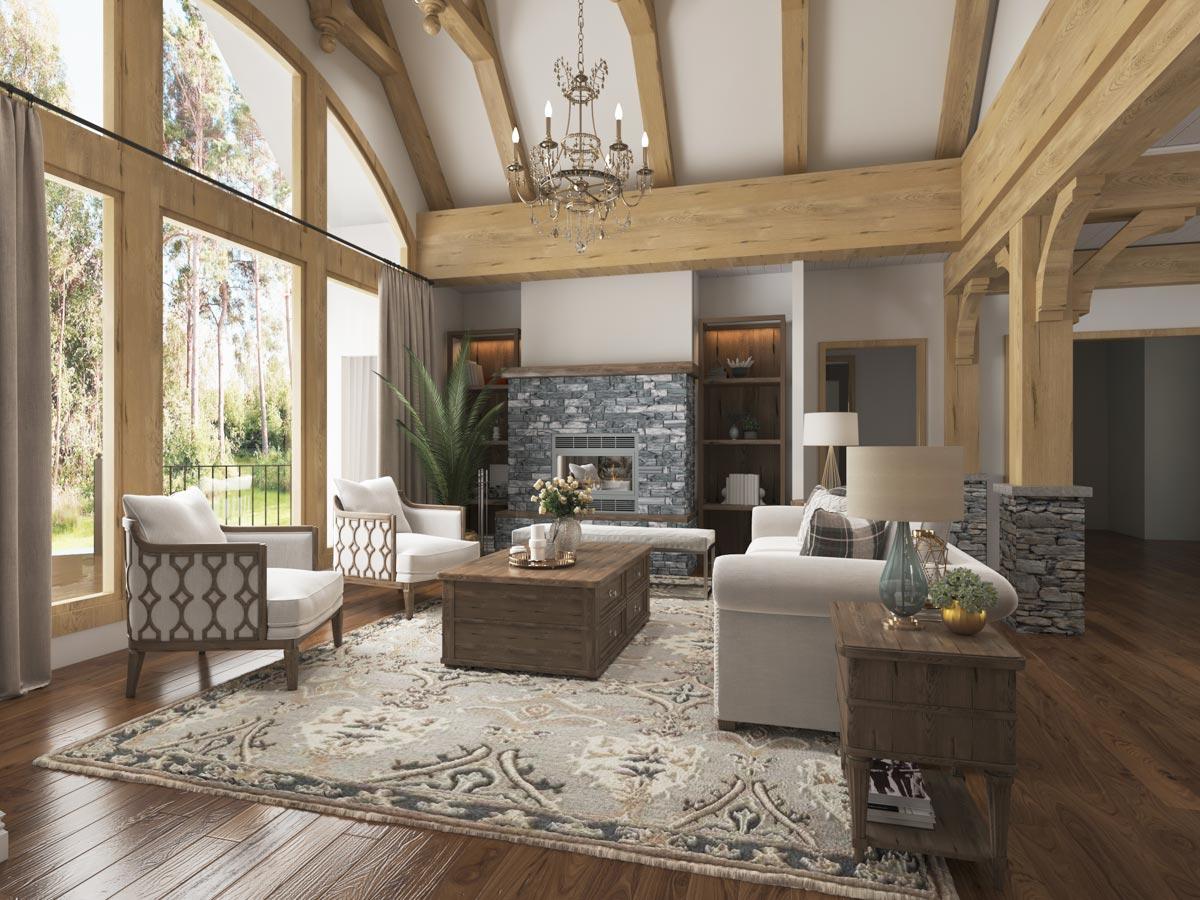 Great room with vaulted wood beam ceiling, stone fireplace, large windows, and open layout.