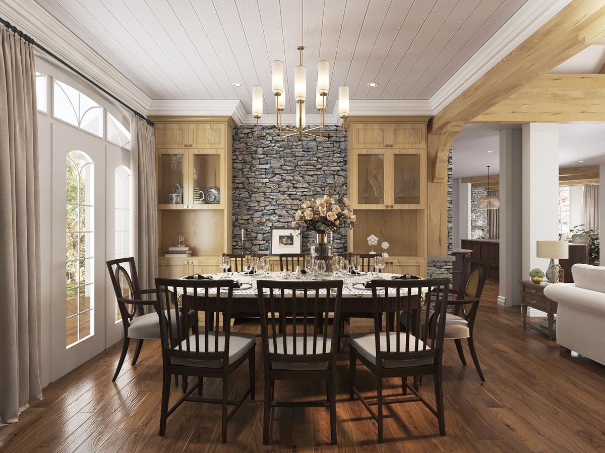 Dining room with stone accent wall, built-in cabinetry, and a chandelier over a formal dining table.