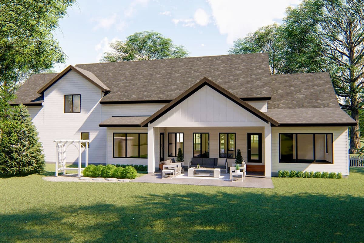 Modern Farmhouse house plan exterior, two stories, with covered patio, large windows, and gabled dormers.