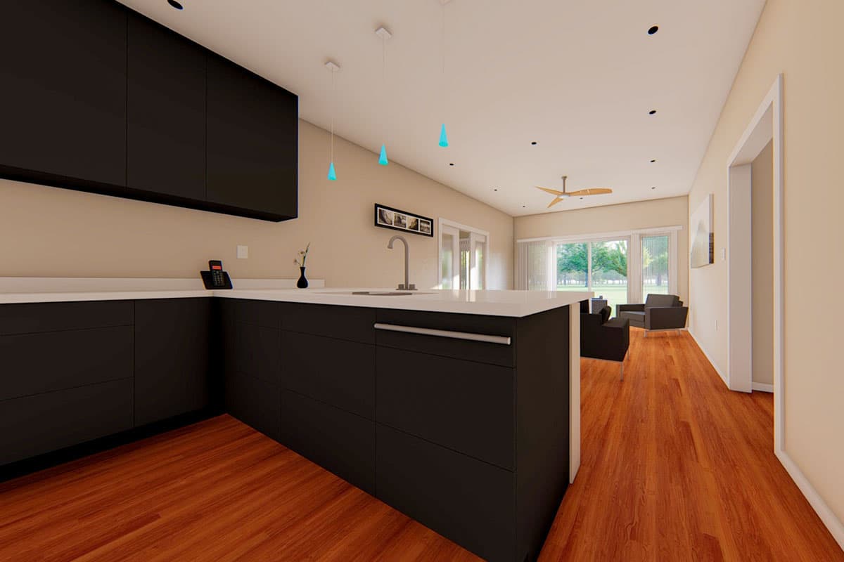 Modern kitchen with dark cabinets, white countertops, island, and view to living area with large windows.