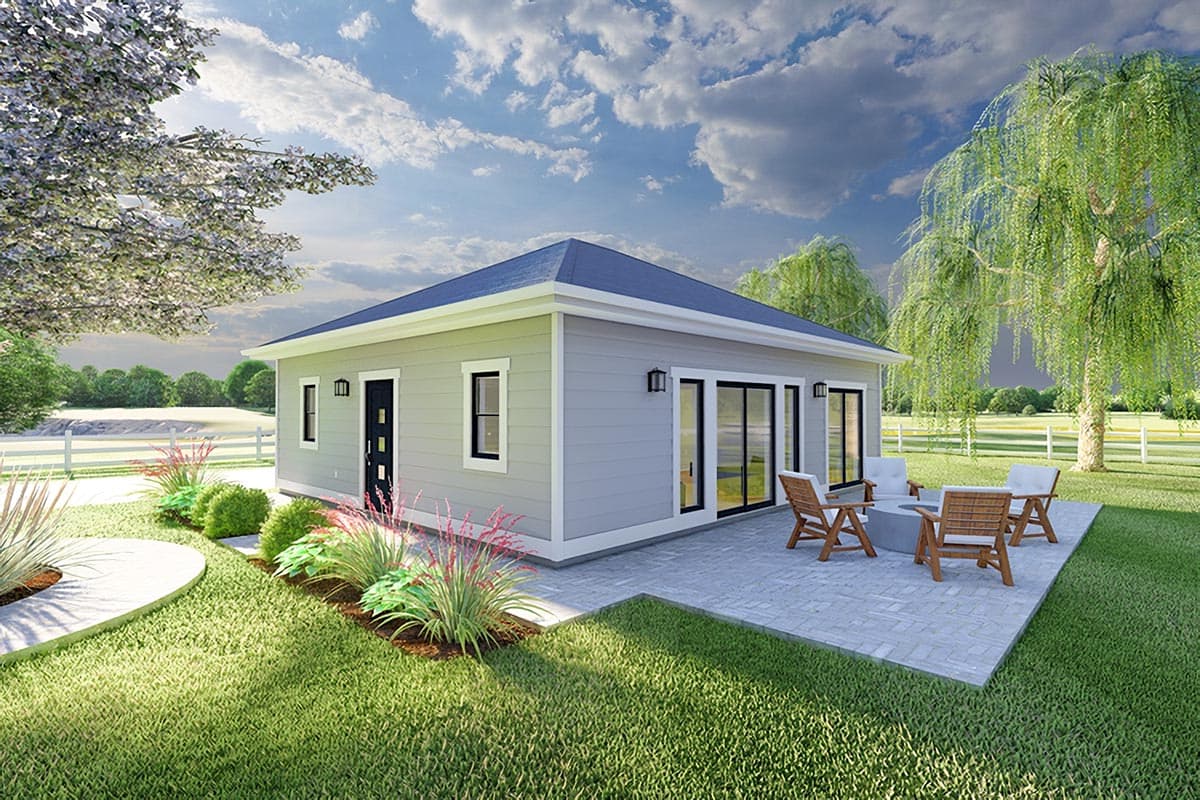 House plan exterior. Single-story, modern style home with a low-pitched roof, sliding glass doors, and a patio area.
