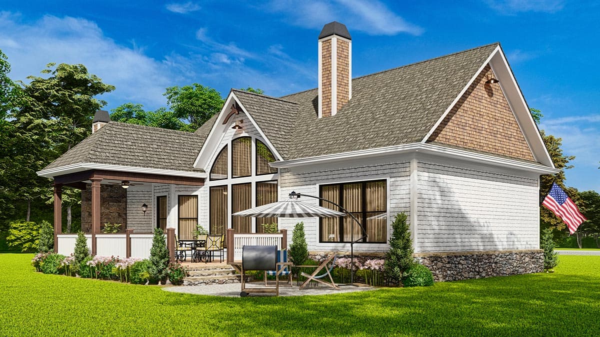 House plan exterior with covered porch, stone foundation, and large arched windows.