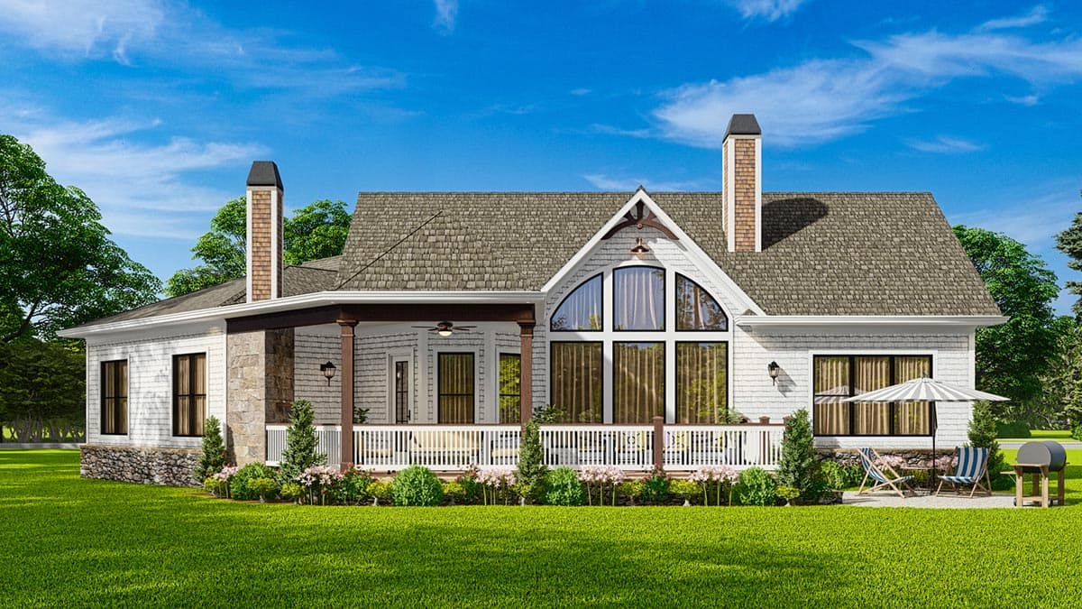 House plan exterior: Ranch style with a covered porch, stone accents, and large arched window.
