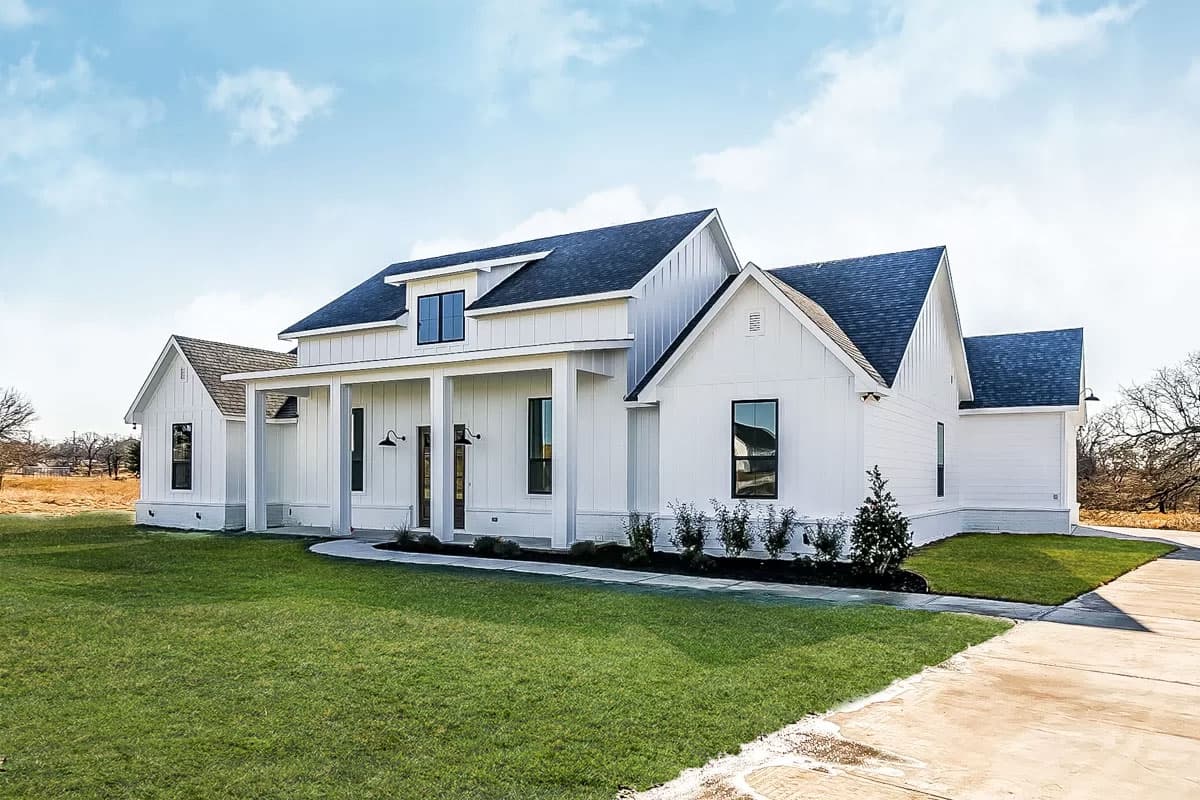 House plan exterior: Modern Farmhouse style, two stories, white board and batten siding, large gables, covered front porch with columns, dormer.