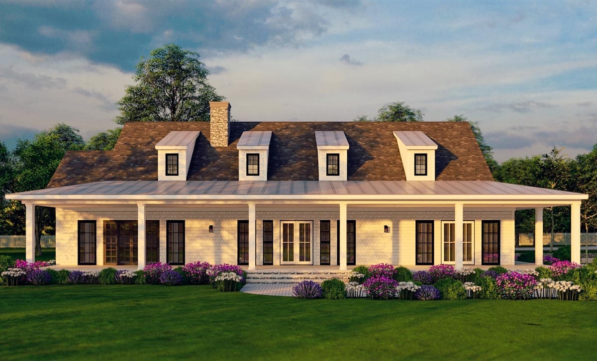 House plan exterior. Two-story farmhouse with a full-width porch, multiple dormers, and a stone chimney. Gable roof with metal accents.