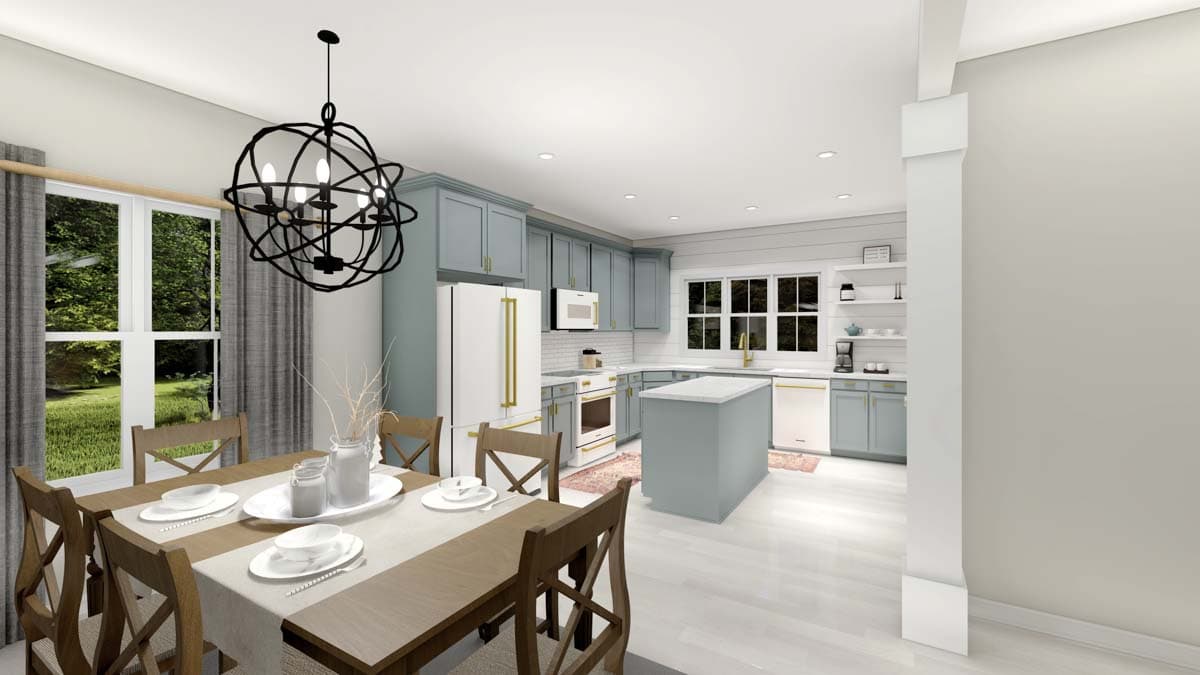 Open concept kitchen and dining area with blue cabinetry, central island, dining table, and large windows.