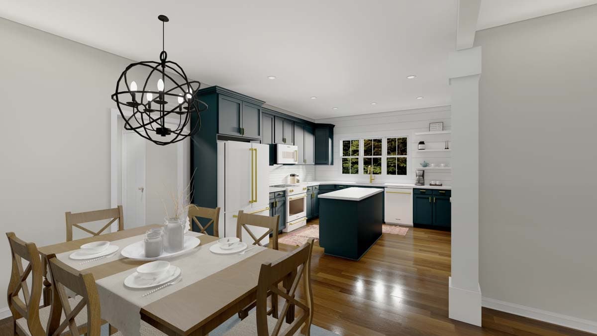 Kitchen and dining area with dark cabinetry, white island, wood table, and orb chandelier.