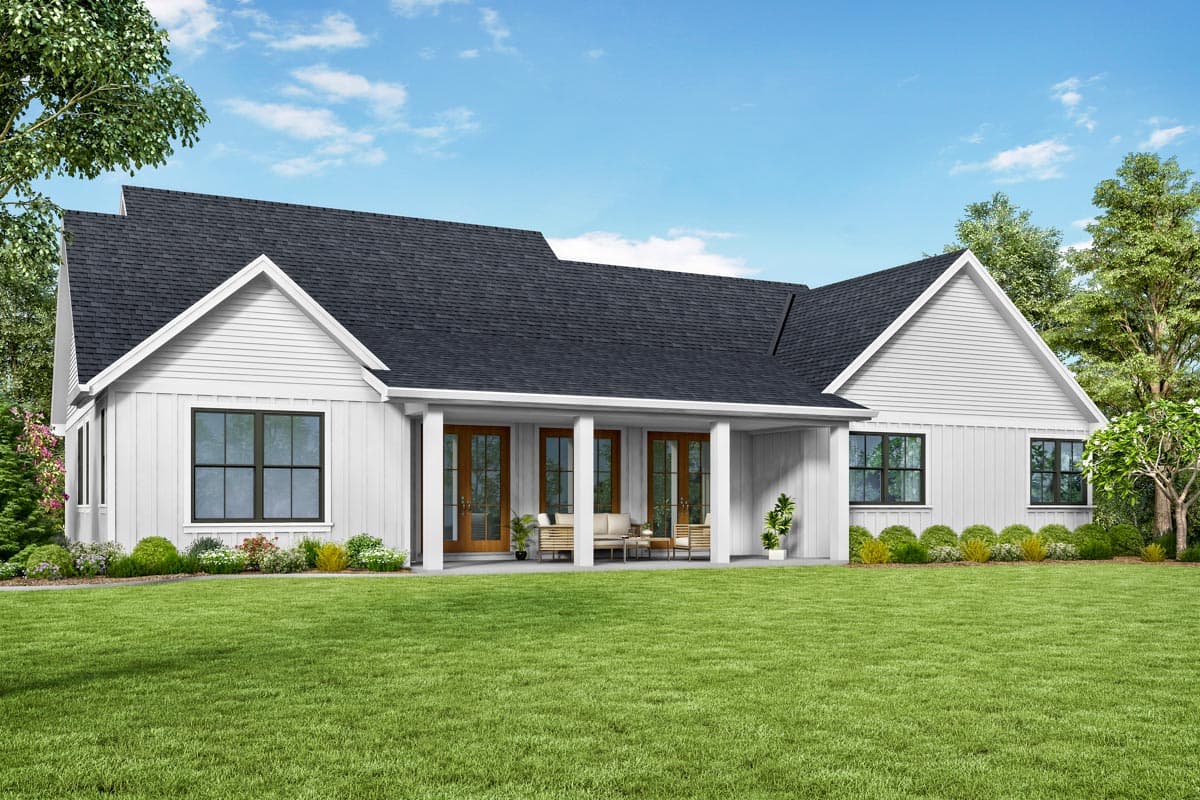 Modern Farmhouse house plan exterior with a covered porch, gables, and large windows. One story.