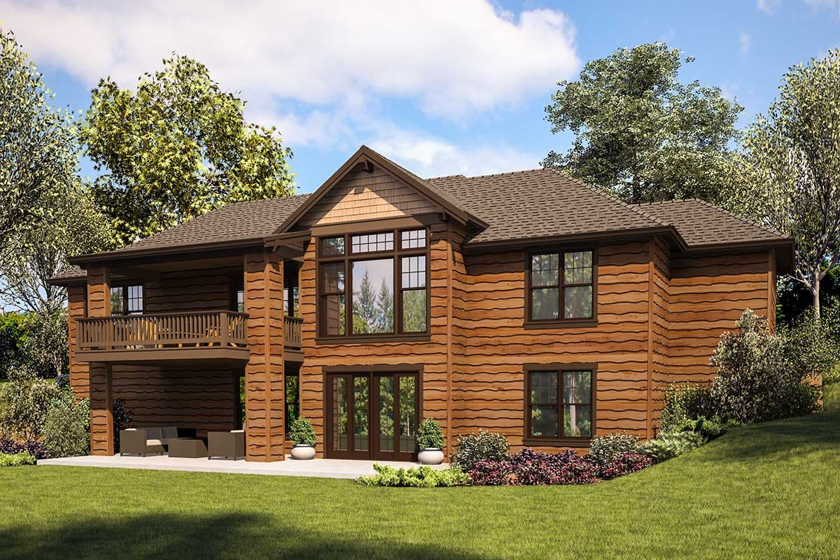 House plan exterior: Two-story lodge style with horizontal siding, covered balcony, prominent gable with shingled details, and large windows.