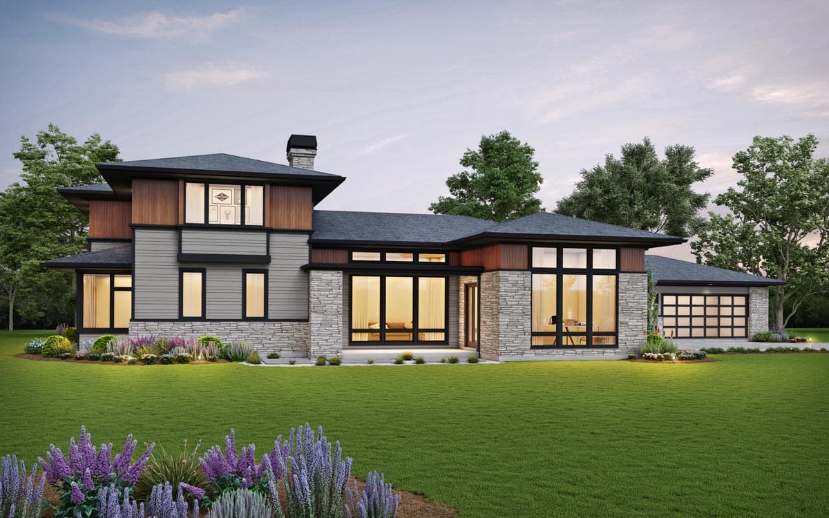 Modern house plan exterior with stone, wood, and siding, featuring a multi-level roof, large windows, and a 3-car garage.