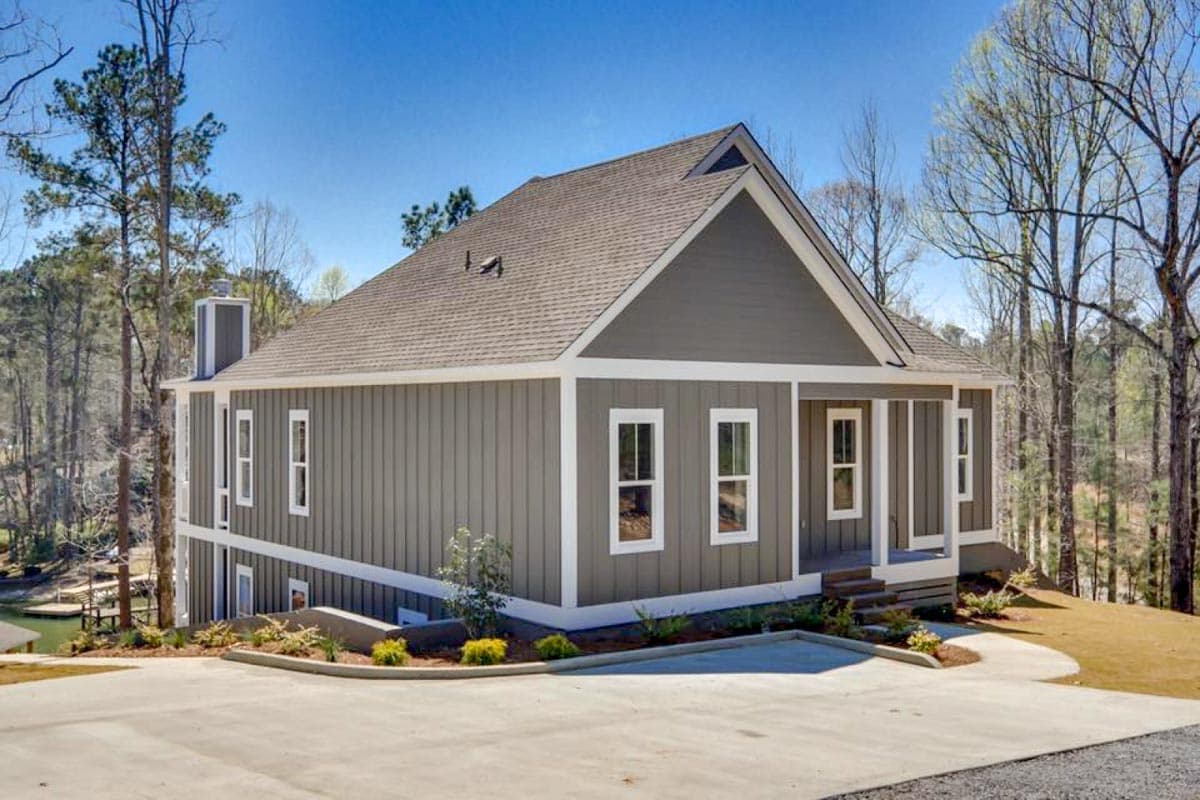 Modern Farmhouse style house plan exterior with siding, gabled roof, two stories, and a covered front porch.
