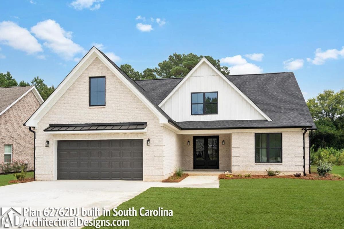 House plan exterior: Modern Farmhouse style, one story, white brick, gabled roof, attached garage, dormer.