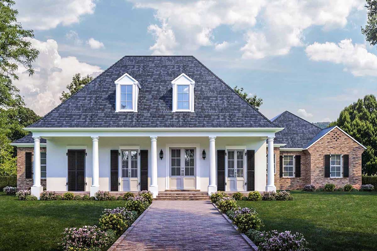 House plan exterior: One-story home with hip roof, dormers, portico supported by columns, and brick accent wing.