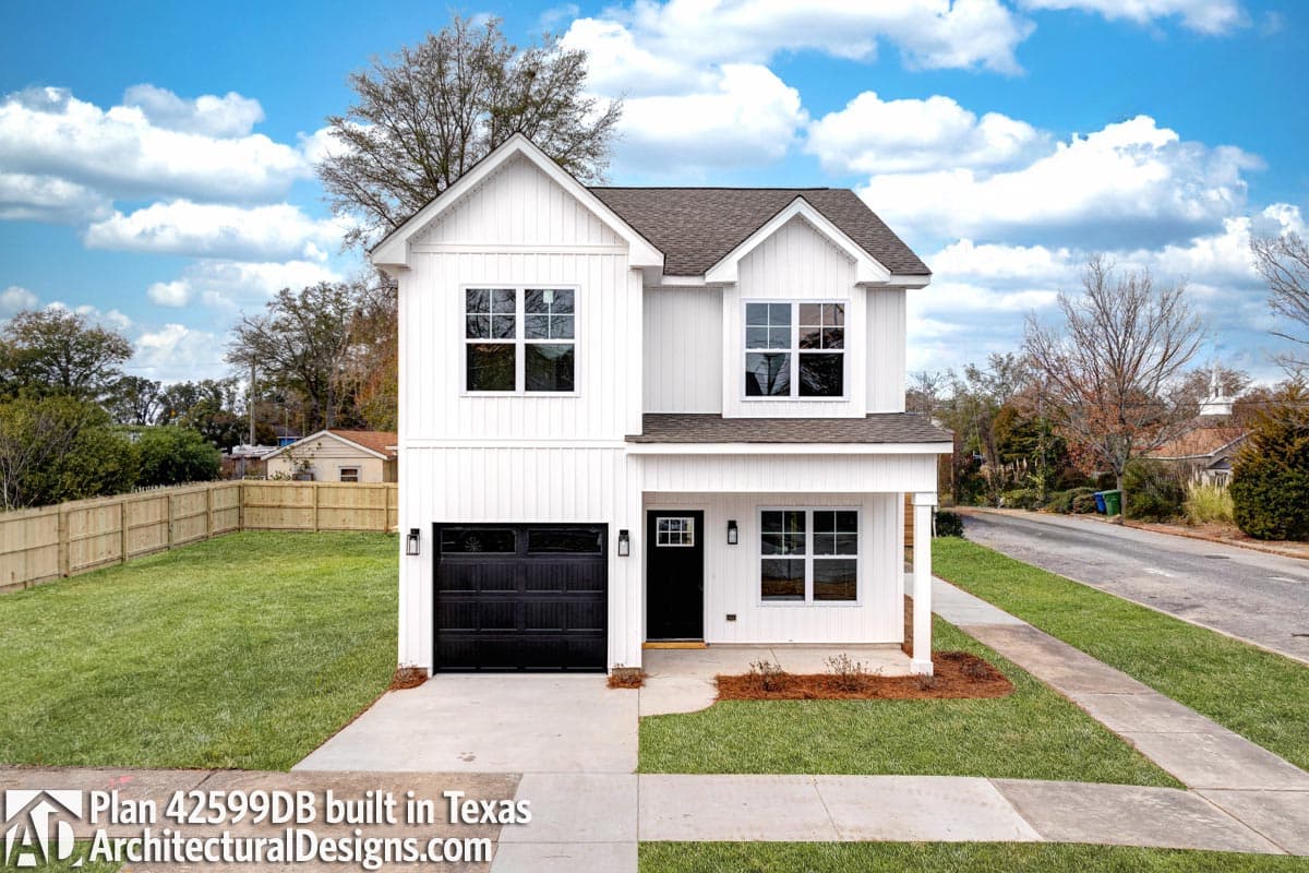 Modern Farmhouse house plan exterior, two stories, board and batten siding, front-facing garage, and gable roof.