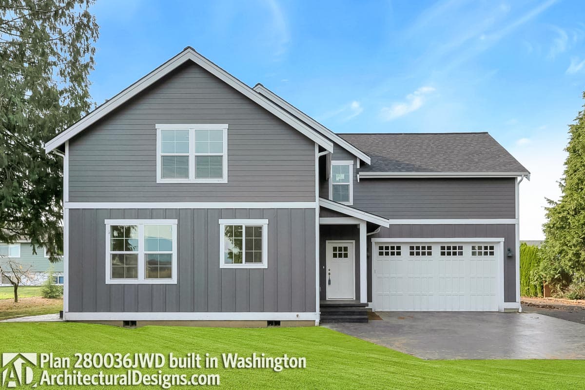 Modern two-story house plan with a two-car garage, gabled roof, and prominent white-trimmed windows.