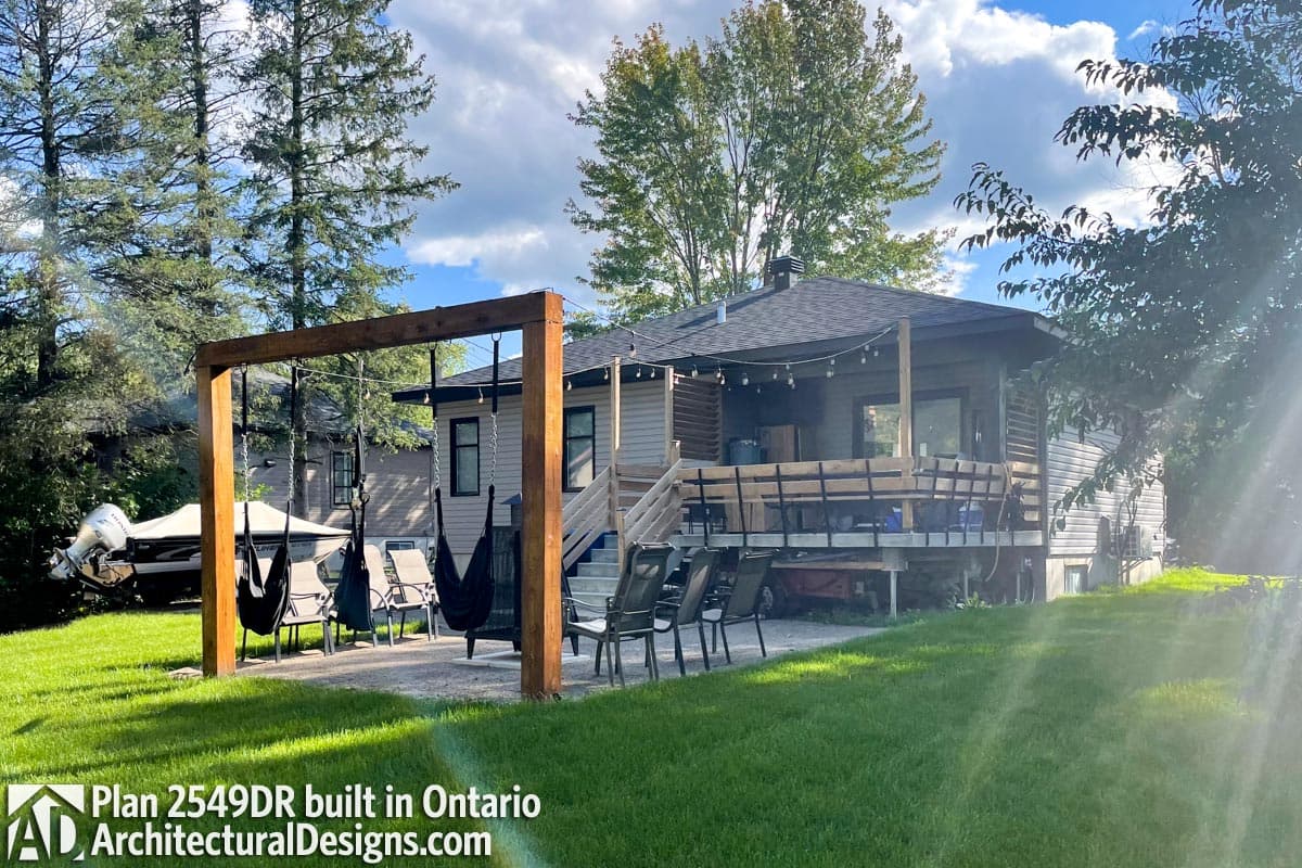 House plan exterior: two-story Modern Farmhouse with gables, porch, and dormers.