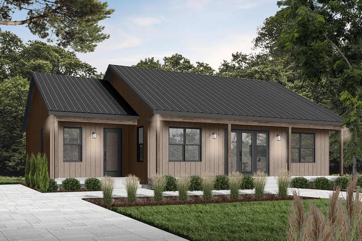 A modern, single-story home with a dark metal roof. The house has wooden siding, black-framed windows, and is surrounded by greenery, creating a clean aesthetic.