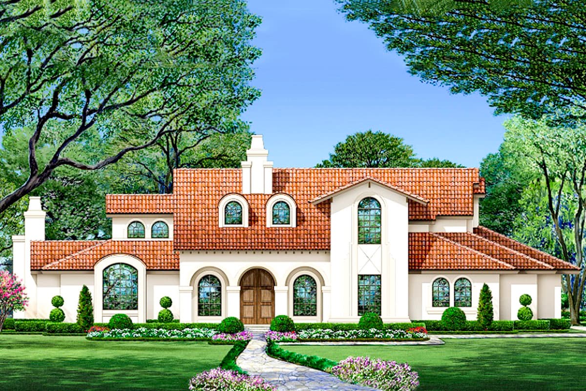 House plan exterior. Two-story Mediterranean style with arched windows, tile roof, and dormers. Features a stone walkway and manicured landscaping.