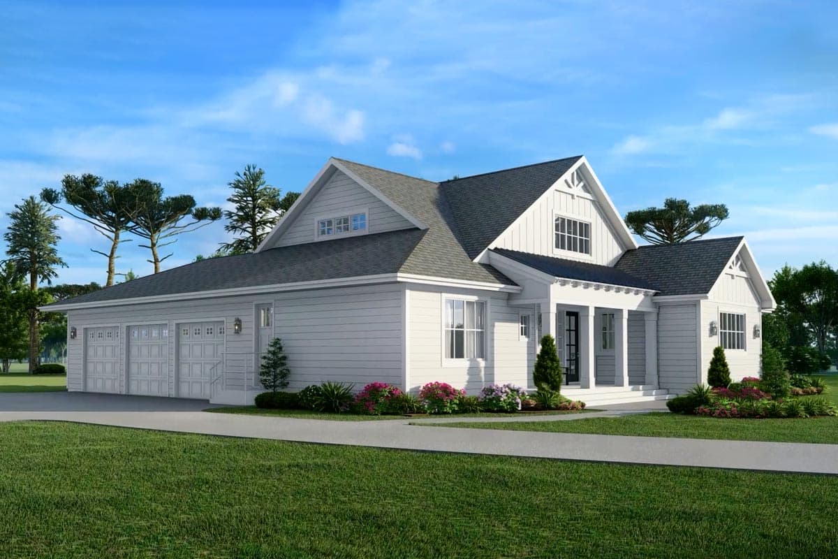 A modern white house with a gray roof and attached three-car garage, manicured lawn, and a paved walkway leading to the entrance.