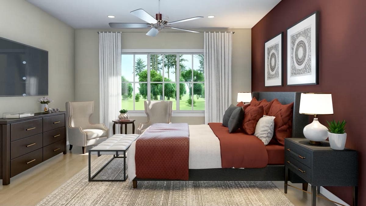 A modern bedroom with a large bed, featuring a maroon comforter, flanked by bedside tables and decorative art pieces, with a large window.