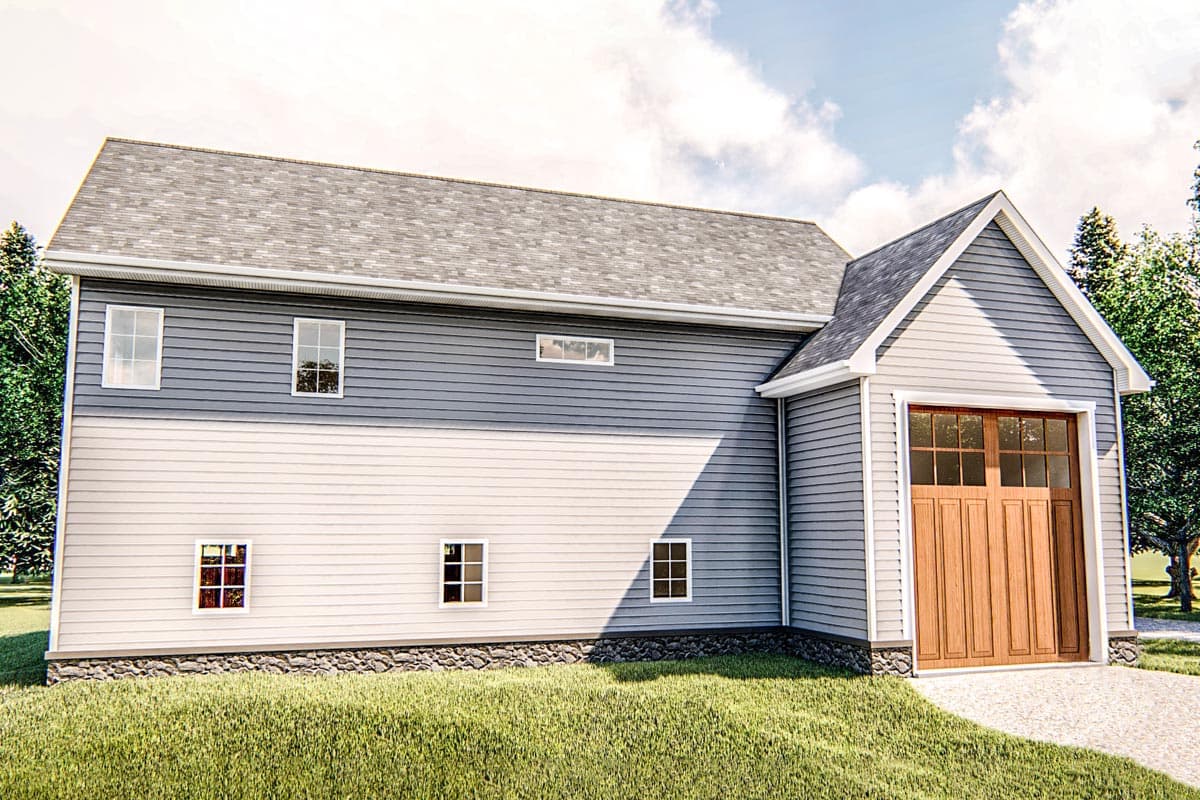 Exterior house plan with two stories, vinyl siding, multiple windows, and a wooden garage door.