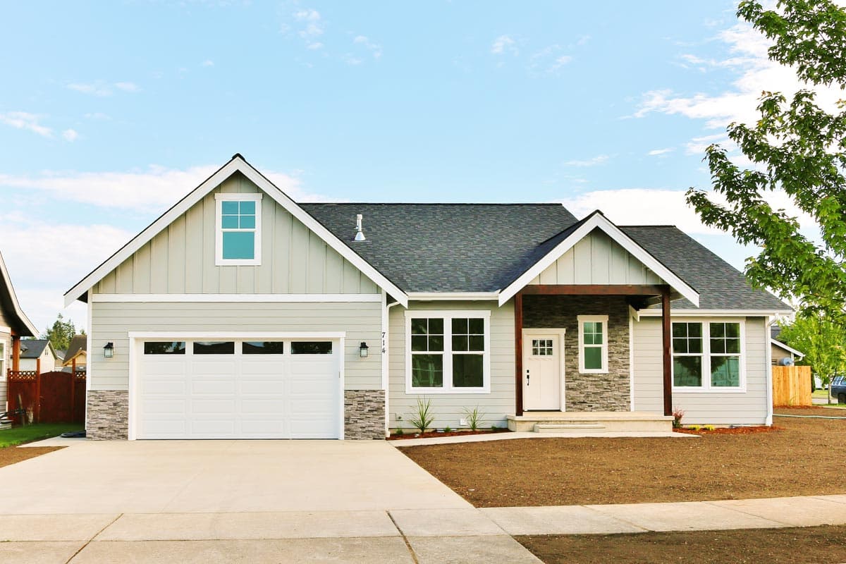 House plan exterior: Single-story Modern Farmhouse with front-facing garage, gables, and covered entry with wood beams.
