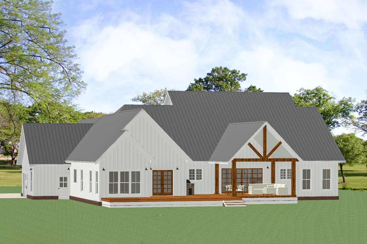 House plan exterior: Modern Farmhouse style with metal roof, gables, dormers, covered porch with exposed beams, and deck.