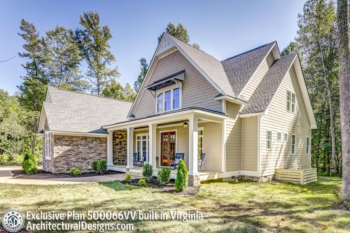 House plan exterior: Two-story modern farmhouse with stone accents, wide front porch, and prominent gables.