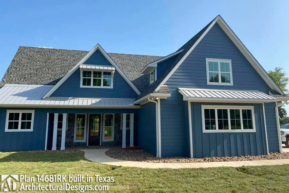 House plan exterior: Modern Farmhouse style, two stories, front porch with stone columns, multiple gables, and metal awnings.