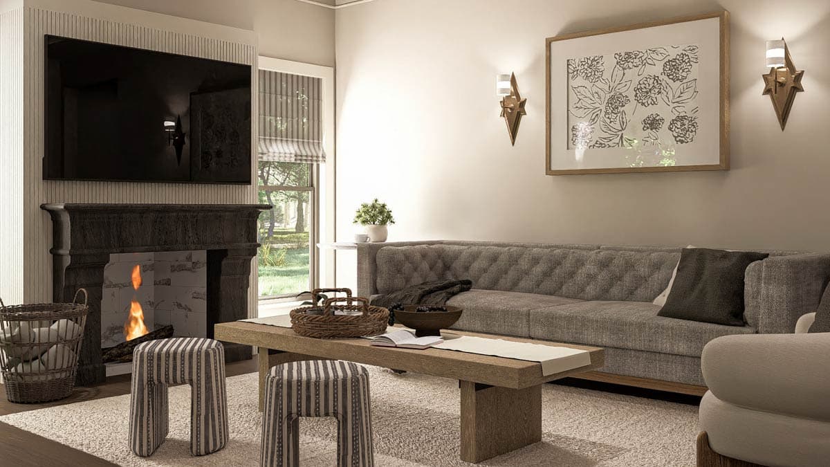Living room with tufted sofa, fireplace, wood coffee table, and two striped stools. Window views of greenery.