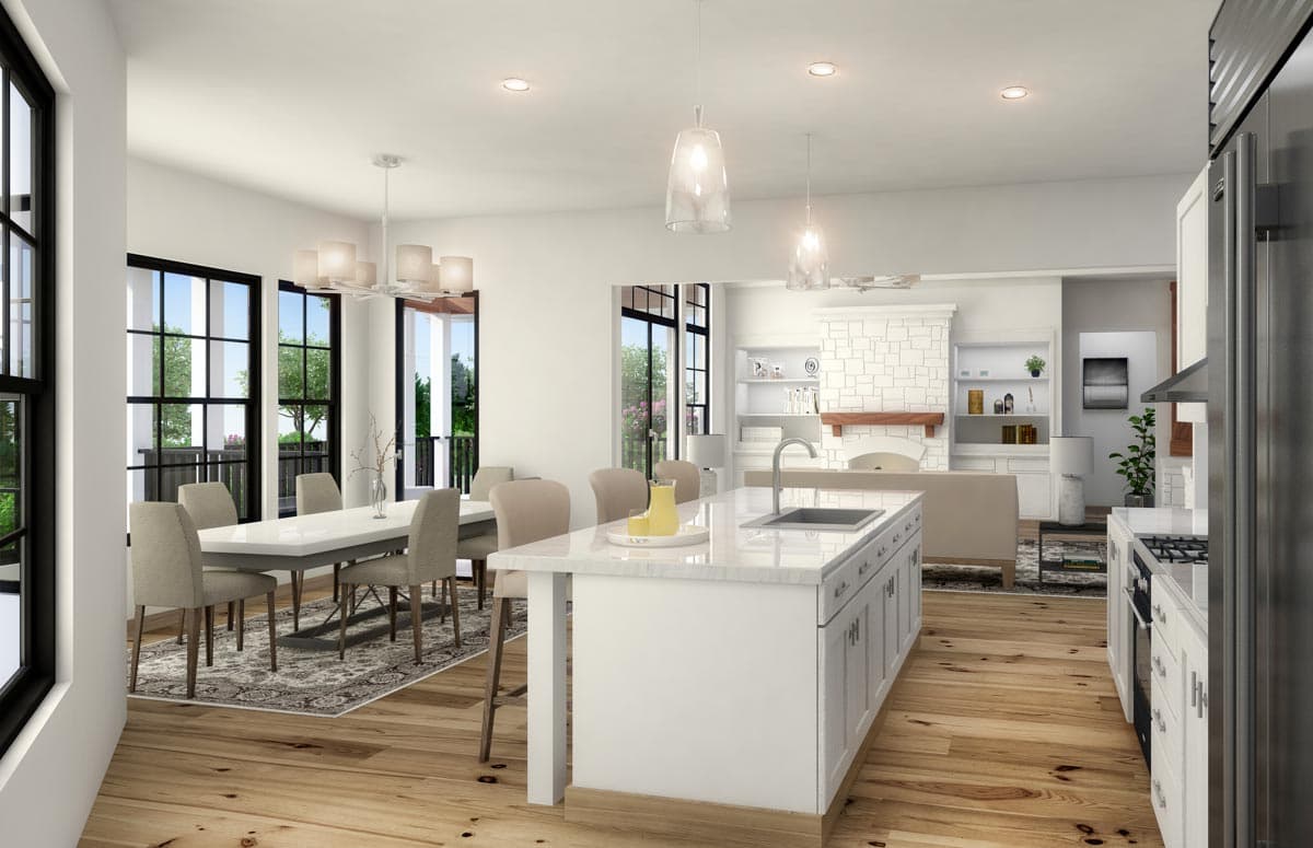 Modern open-concept kitchen and dining area with island, fireplace, and large windows.