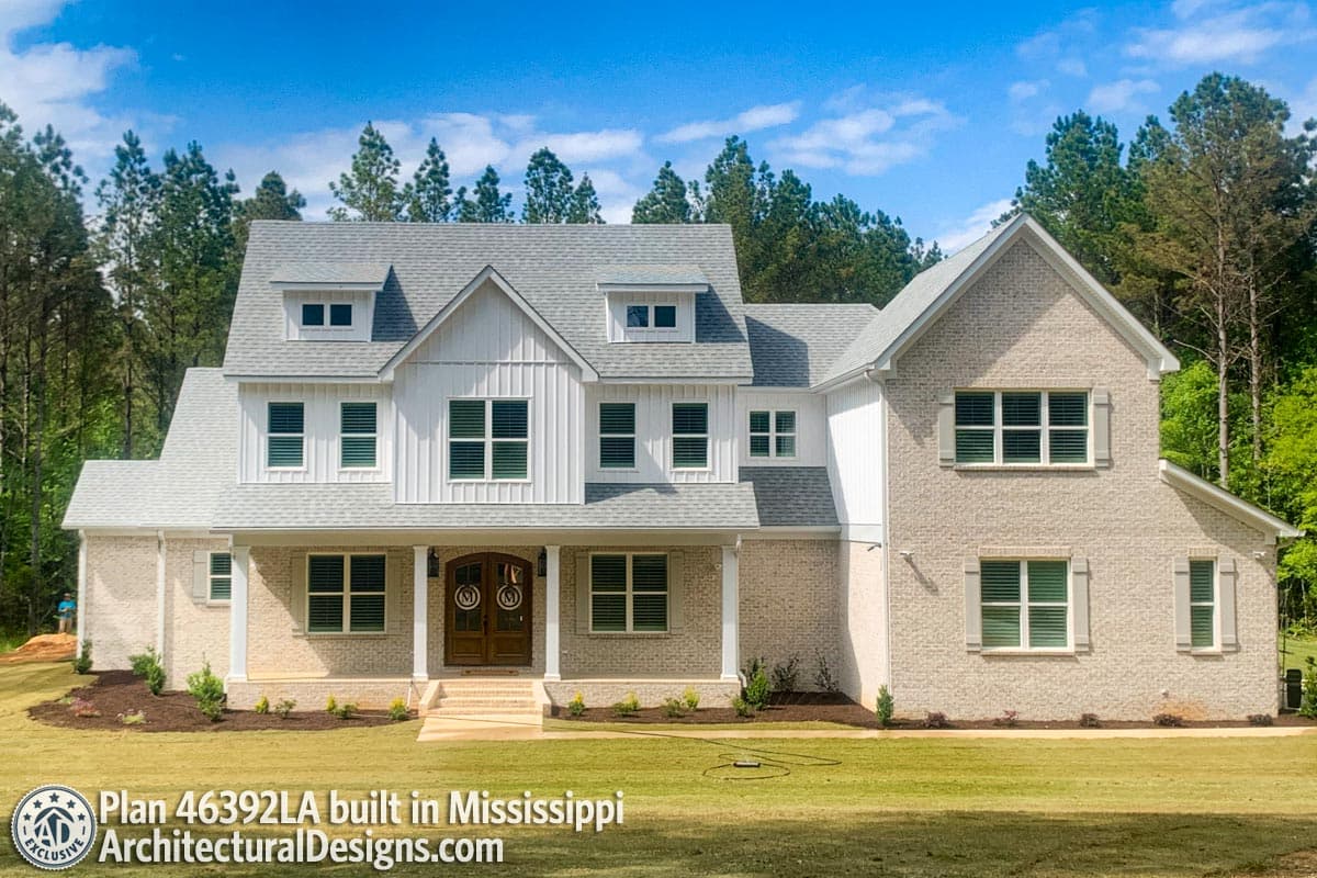 Modern Farmhouse house plan exterior, two stories, with a covered front porch, gables, dormers, and board-and-batten siding.